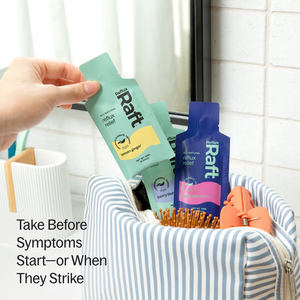 RefluxRaft To-Go alginate pouches in a travel bag — take before symptoms start or when they strike for on-the-go heartburn and acid reflux relief